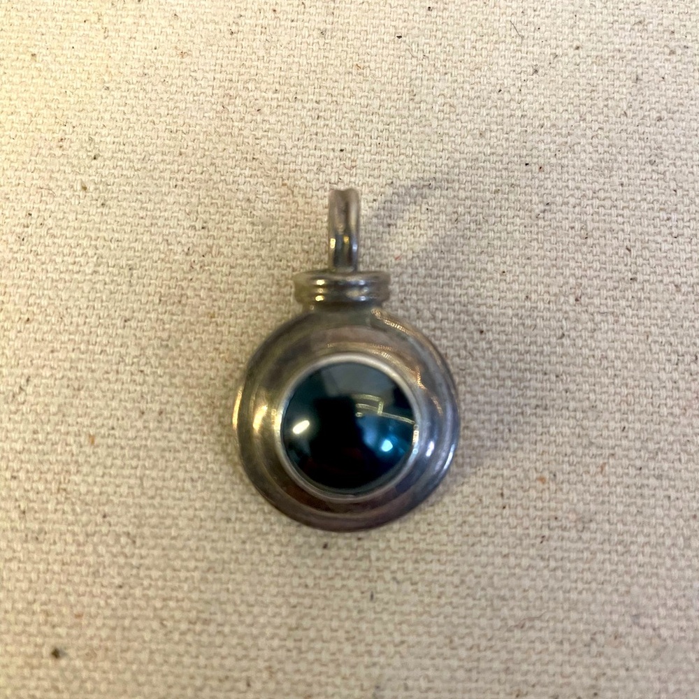 Sterling silver pendant with stone accent